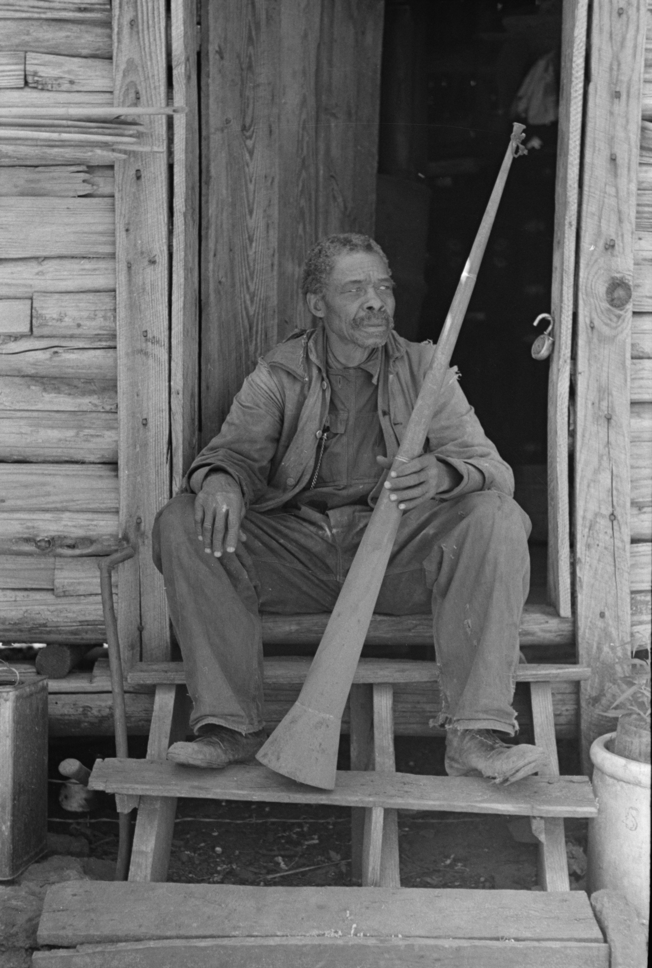 A_former_slave_displaying_a_horn_used_to_call_slaves