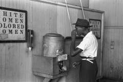 Colored__drinking_fountain_from_mid-20th_century_with_african-american_drinking